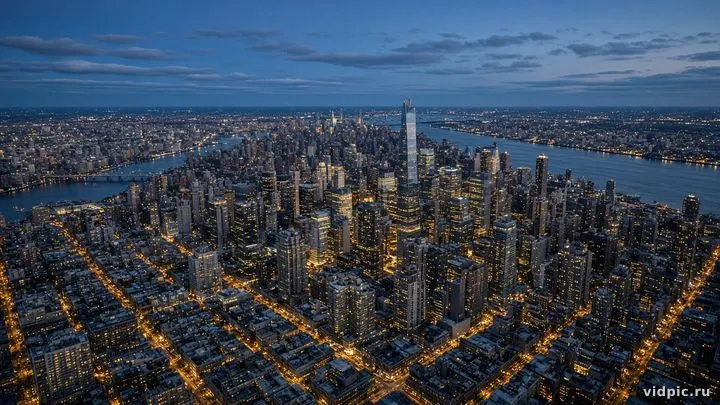 A geometric city grid at blue hour from above.