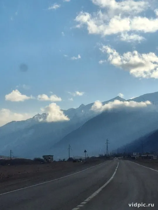 Empty mountain road stretching into the distance. Perfect for travel and car advertisements.